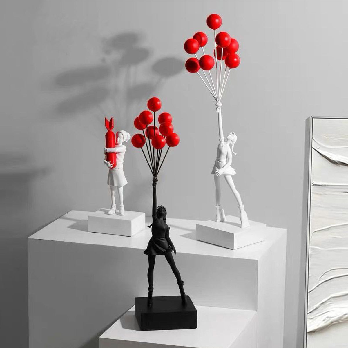 Flying Balloon Girl Banksy Statue collection in black and white with red balloons, urban art sculptures