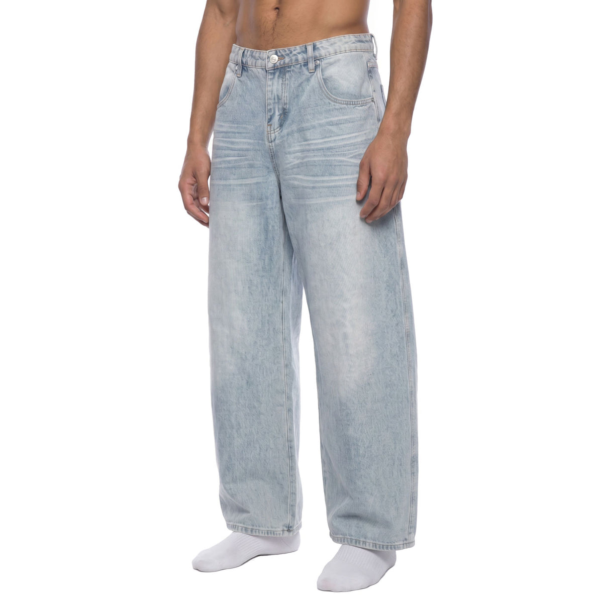 Vintage wash wide leg denim pants, front angle view showing loose straight leg and whiskering across the hips