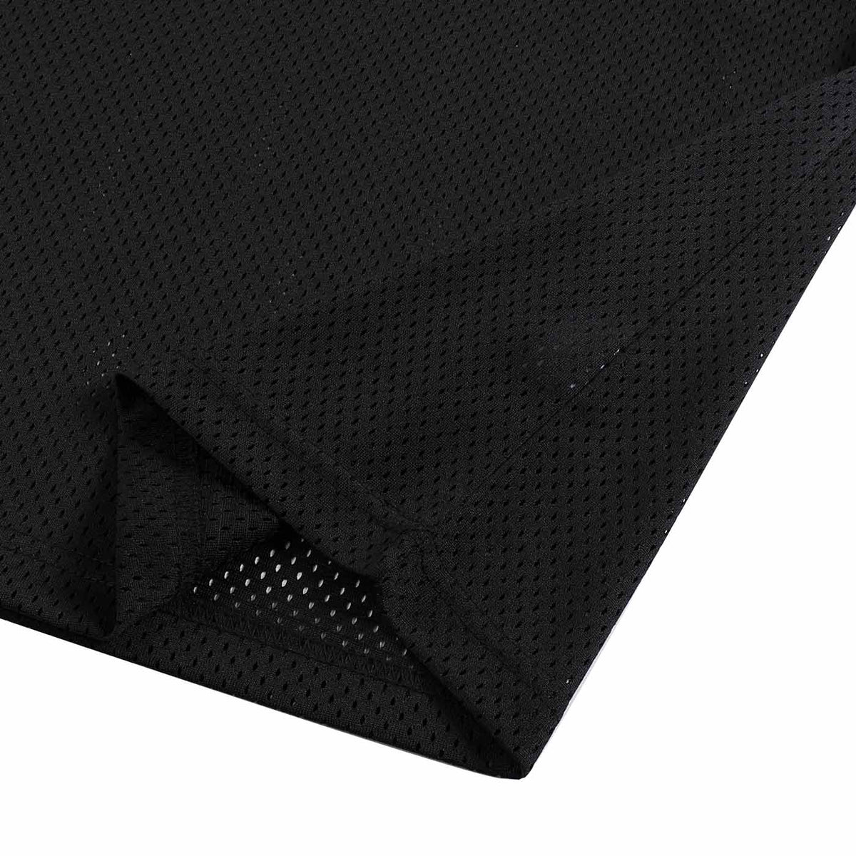 Close-up of breathable perforated mesh fabric and side vent on black Mesh Boxy Jersey Tee