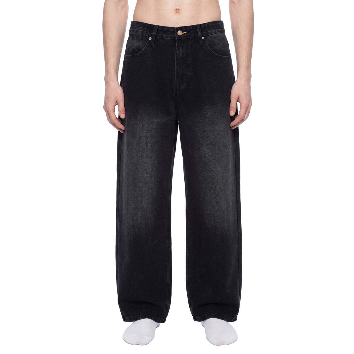 Washed baggy wide leg jeans in black, front view on male model showing loose fit and faded wash