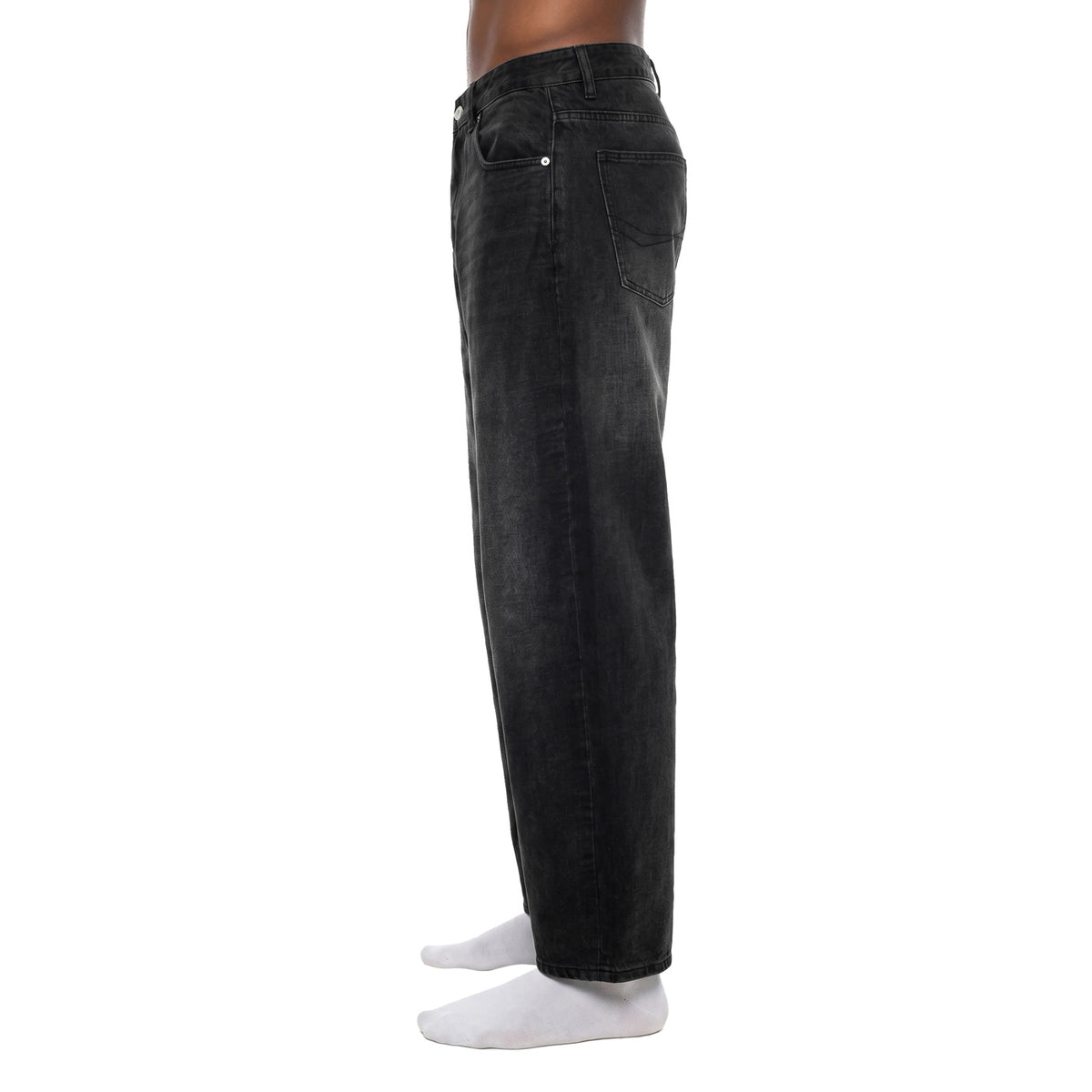 Side view of black barrel jeans showing curved balloon silhouette and ankle-length hem