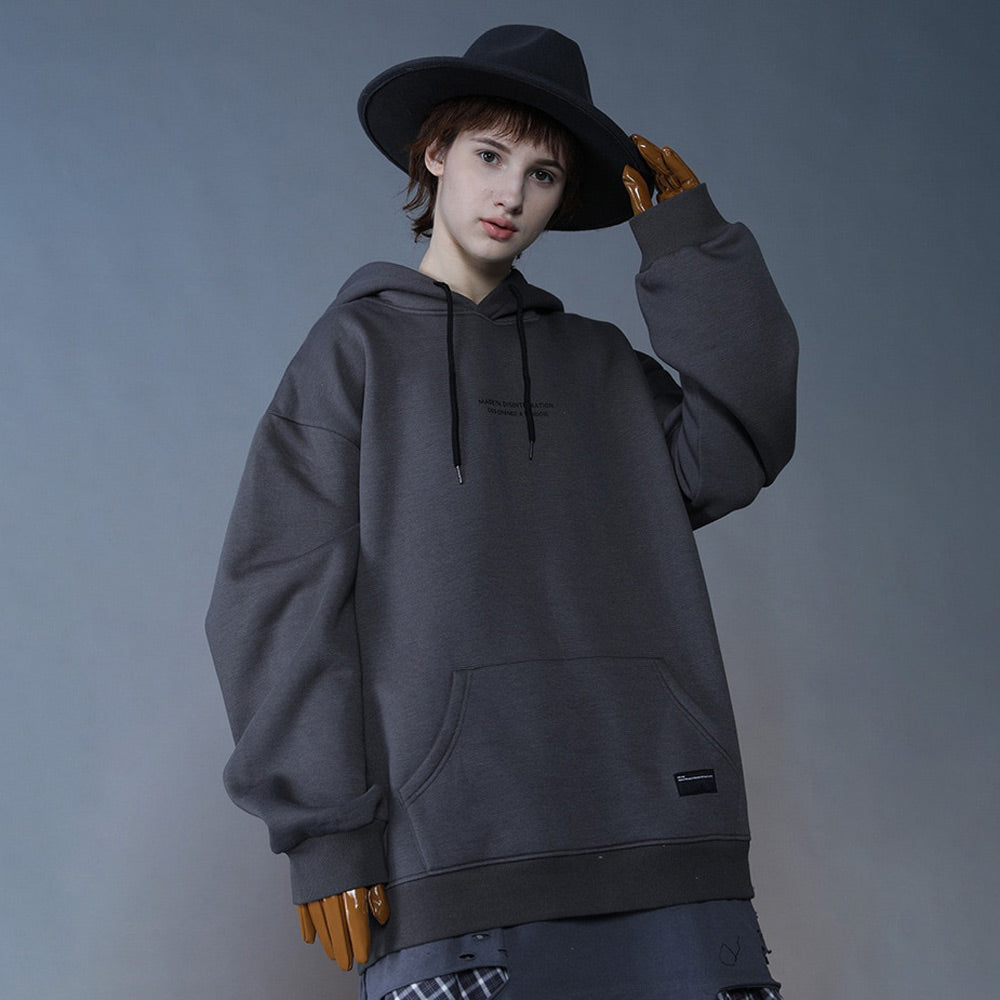 Model in grey Angel Hoodie: Edgy streetwear with artistic statue design