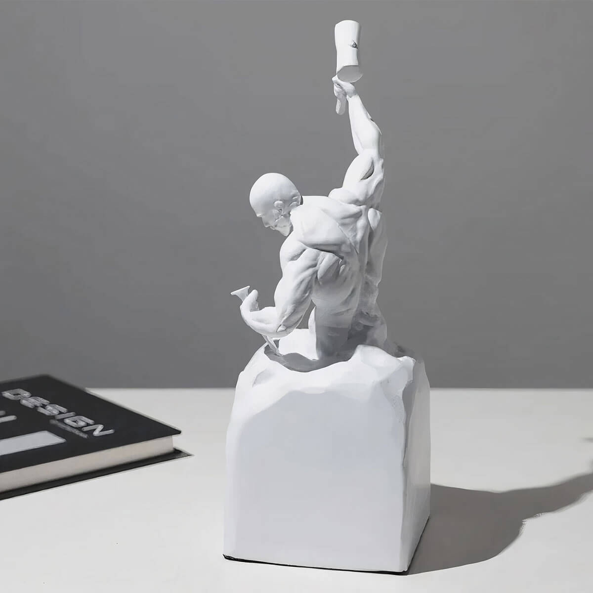 Bodybuilder figurine in white showing muscular physique and self-sculpting design