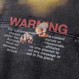 A dark vintage-style washed hoodie with a creepy horror design.