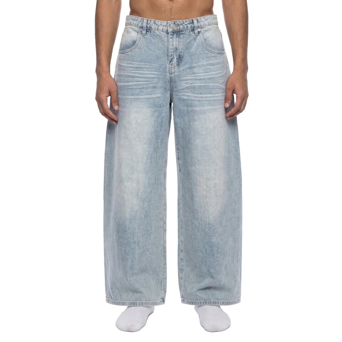 Light blue baggy wide leg jeans, front view on male model showing high-rise waist and vintage wash