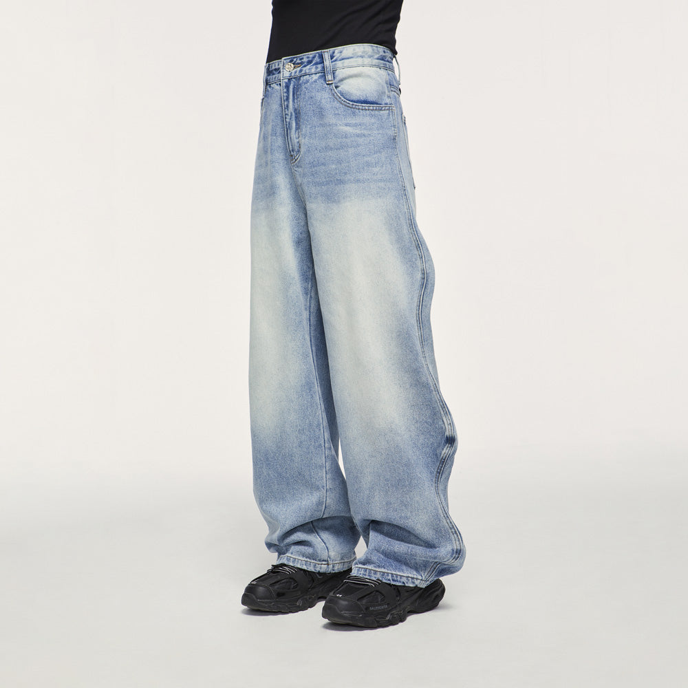 Side view of baggy wide leg jeans in vintage denim, highlighting the relaxed fit and trendy silhouette.