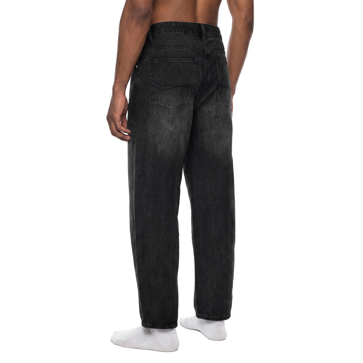 Back angle view of washed black baggy barrel jeans showing rear pockets and sunfade