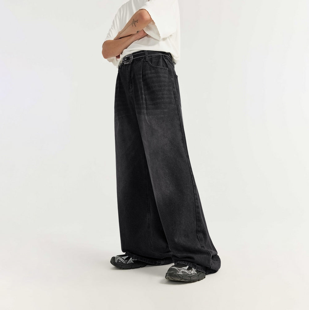 Washed black wide leg jeans on male model